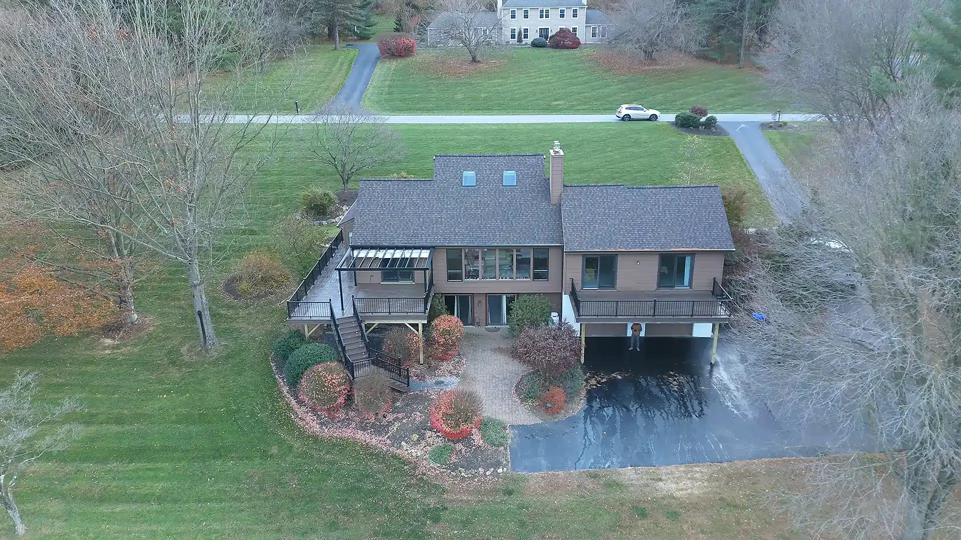 Aerial view of home with multiple decks and patio - Patio contractors and outdoor living spaces builders tri-state area pennsylvania