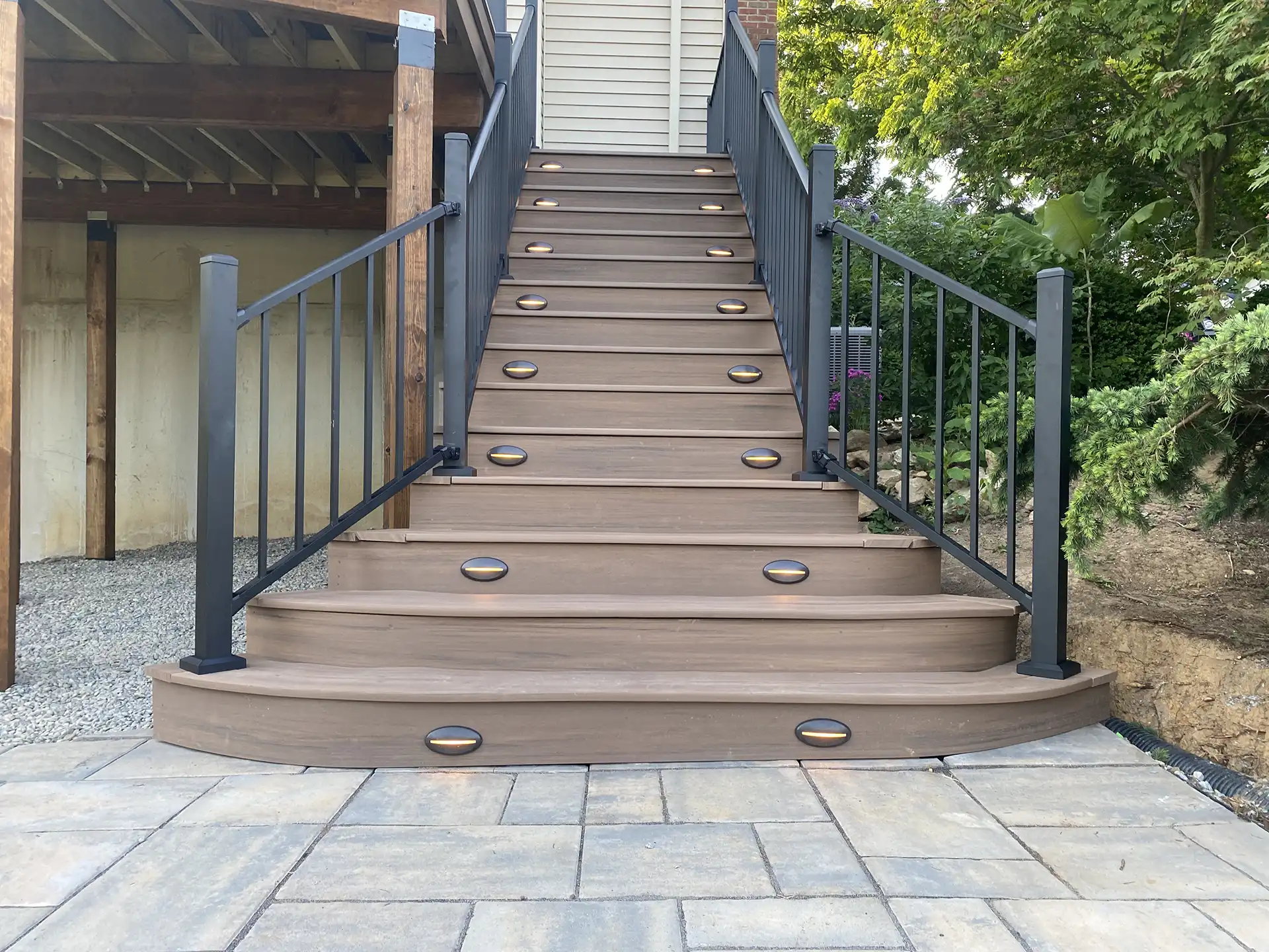 photo of a custom deck with deck railing, deck steps, and deck lighting - custom deck with deck railing, deck steps, and deck lighting - Custom Composite Deck builder and contractor - Pennsylvania