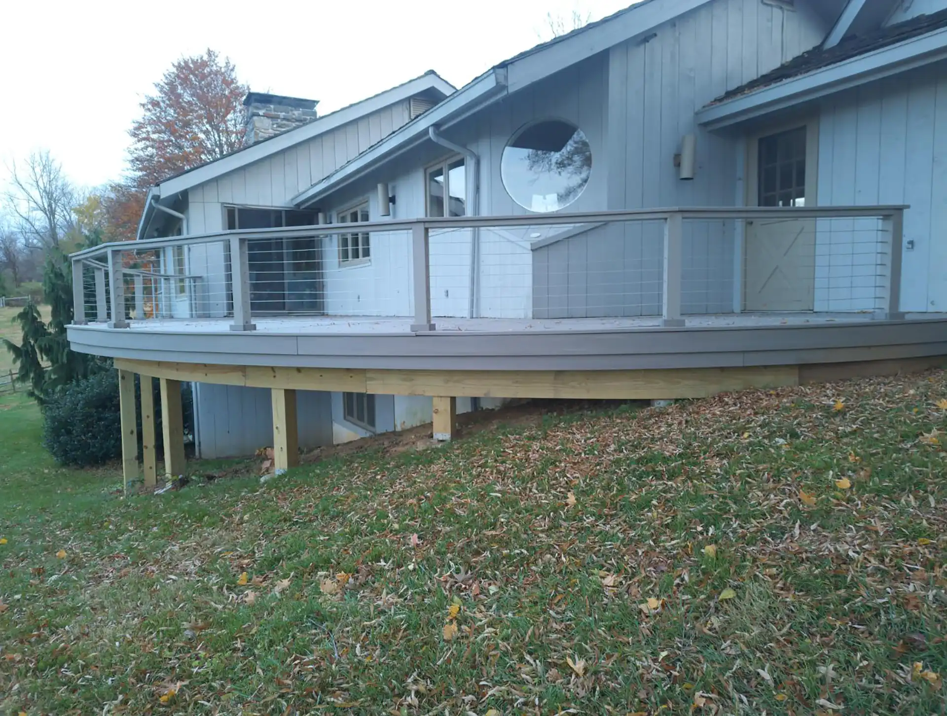 photo of curved deck railing with cable railing - Deck railings contractor in pennsylvania