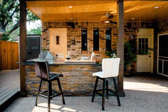 photo of an outdoor kitchen with an outdoor bar - Outdoor Kitchen Builder in PA